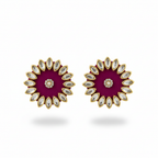 Pair of earrings with a purple center and gold and white accents on a white background