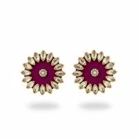Pair of earrings with a purple center and gold and white accents on a white background
