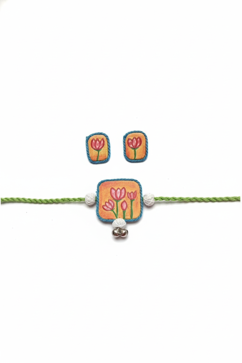 Set of bracelet and earrings with floral design on a white background