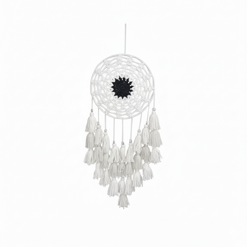White dreamcatcher with black center on a white background